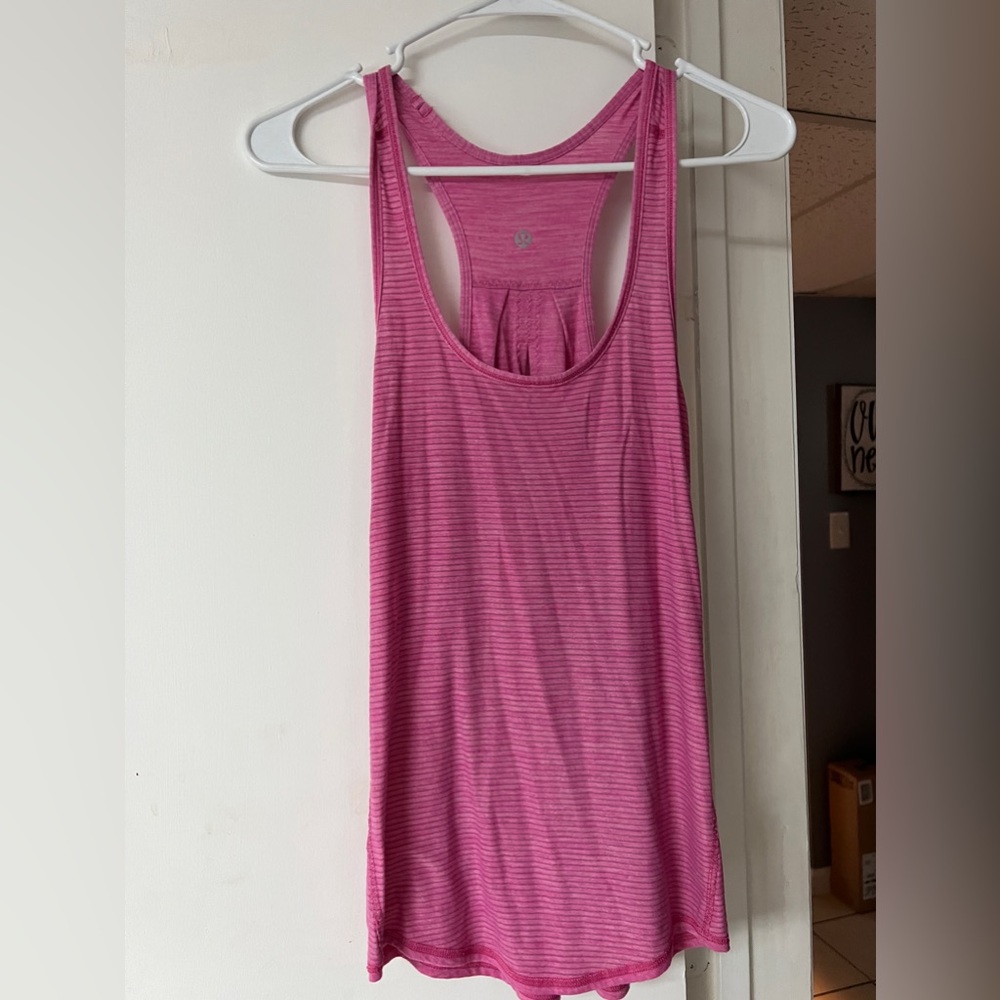 Size 4 pink lululemon tank! worn for about a year!